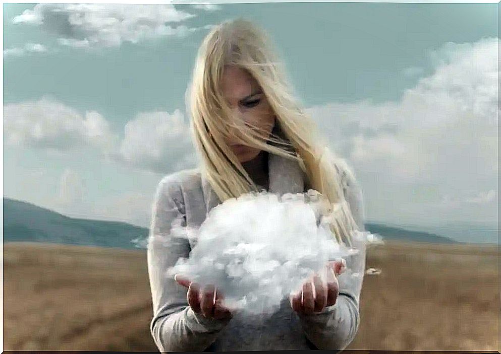 A woman holding a cloud