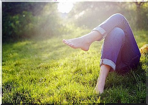 Woman enjoying herself in the grass