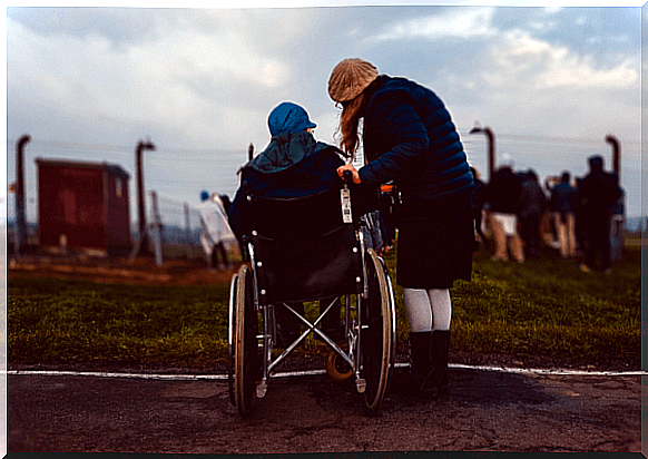 Girl in wheelchair with her friend