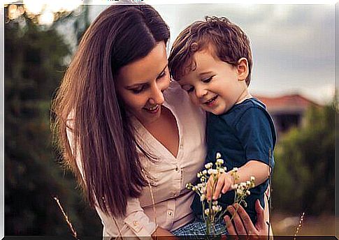 Mother looking at flowers with her son, because she is not a bad mother