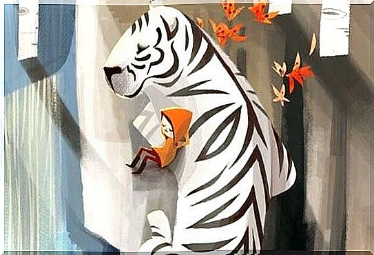 Child leaning against a white tiger