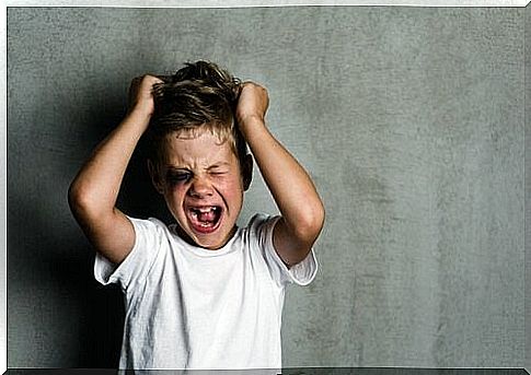 boy with hands in his hair