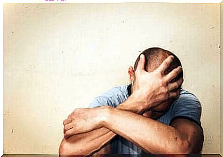 Man sits exhausted on the floor