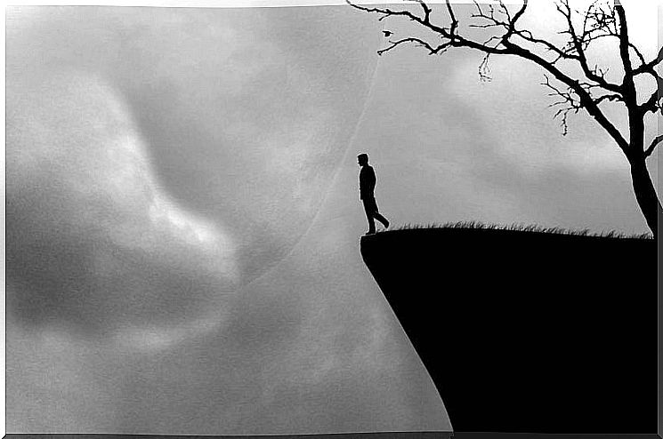 Man on the edge of the abyss, feeling like routine becomes limiting