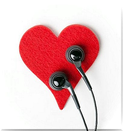 Red heart with two earplugs on it because your body talks too