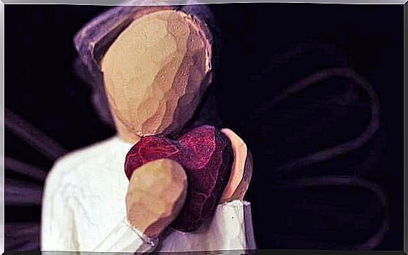 Doll holding her own heart after a breakup