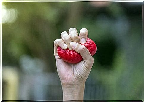 Hand holding a stress ball because it can help when your emotions overwhelm you