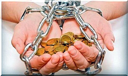 Chained hands holding money